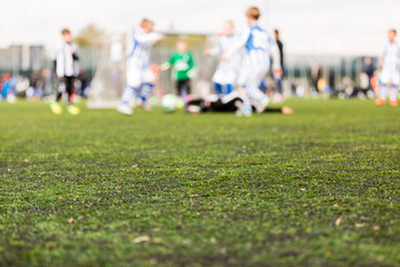 Blurred young kids playing soccer