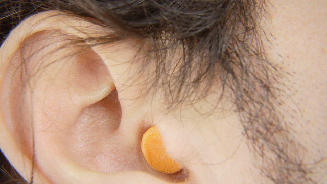 Ear plugs man insert remove