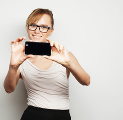 Fototapeta premium businesswoman holding mobile phone