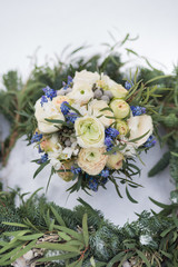 Beautiful wedding bouquet with spruce scarf