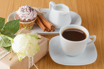 coffee, white rose and gift