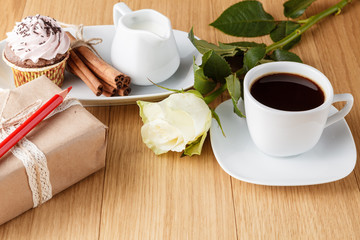 coffee, white rose and gift