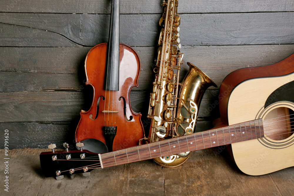 Sticker musical instruments on wooden background