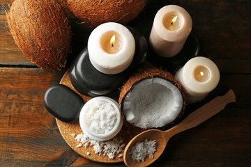 Spa coconut products on dark wooden background