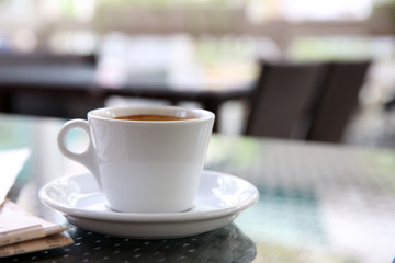 Cup of tasty coffee in cafe