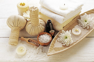 Spa composition and treatments on light wooden background, close-up