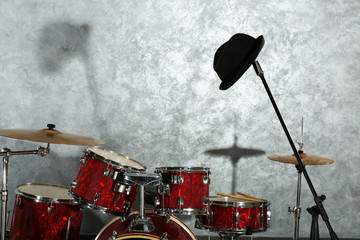 Fototapeta na wymiar Drum set on brick wall background