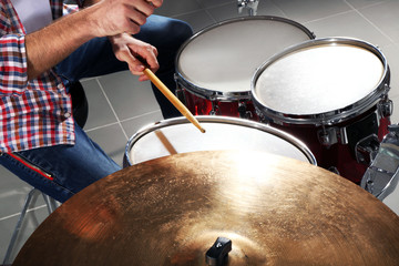 Musician playing the drums closeup