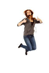 Teenage woman jumping showing thumbs up