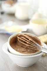 Cooking chocolate cream on kitchen