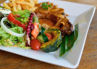 grilled pork chop with salad