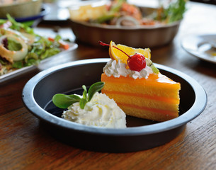 Orange cake on wooden background