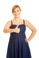 Happy overweight woman with thumbs up