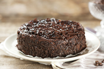 Tasty chocolate cake on wooden background
