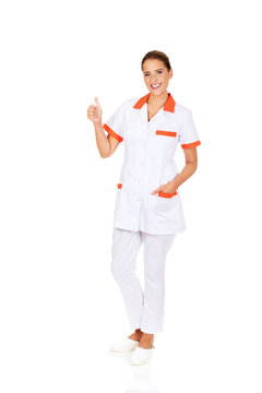 Young Smile Female Doctor Or Nurse With Thumbs Up
