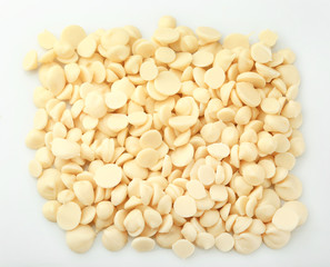 White chocolate morsels isolated on white