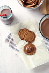 Melted chocolate onplate, on wooden background