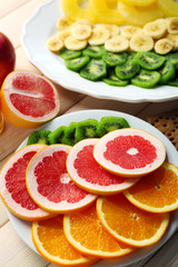 Naklejka na ściany i meble Fruits on wooden background. Healthy eating concept.