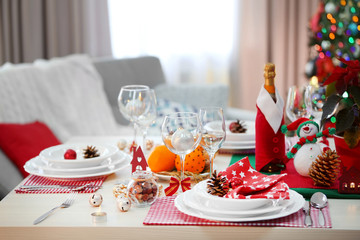 Christmas table setting on light room background