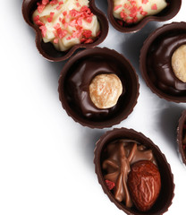 Assorted chocolate candies, isolated on white