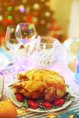 Fototapeta na wymiar Backed chicken on a Christmas table setting