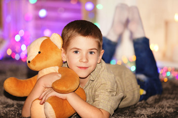 Little boy with Teddy bear on a blurred background