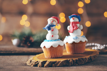 Christmas cupcakes on wooden stand