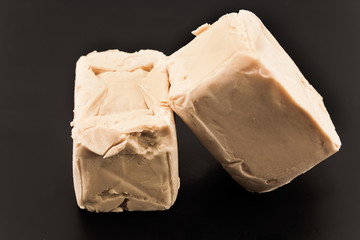 Raw yeast on a black background