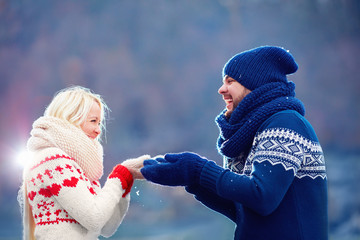 joyful couple in love having fun in winter