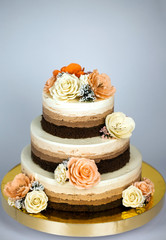 Obraz na płótnie Canvas Naked cake. Wedding rustic cake with flowers.