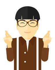 Hopeful man keeping fingers crossed.