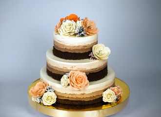 Naked cake. Wedding rustic cake with flowers.