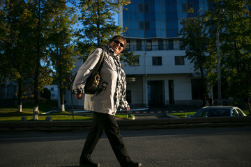 Outdoor portrait of mature woman  in city street. Lifestyle.