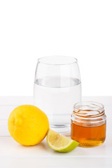 Healthy drink with honey, lemon and lime