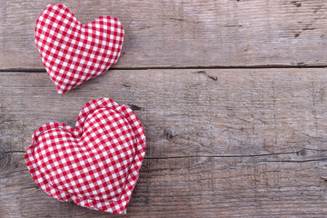 Fototapeta premium Handmade Hearts on wooden board, Valentines Day background