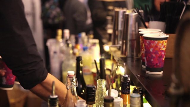 Serving cocktails drinks by bartender in bar 