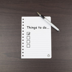 Note paper first box check with a word Things to do..