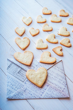 love flies out of the envelope. romantic message on Valentine's Day. cookies in the shape of heart