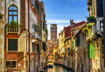 Venice cityscape, water canal, campanile church and traditional