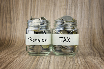 Two glass jars with coins labeled Pension and TAX. Financial Conceptual