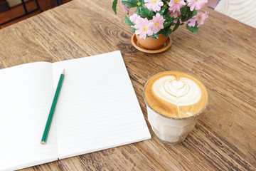 Cup of coffee latte art on wood table