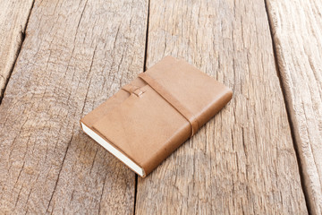 Brown Leather notebooks on wooden table