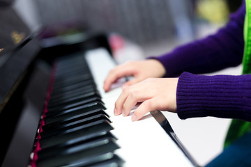 Fototapeta premium Asian cute boy playing piano at home