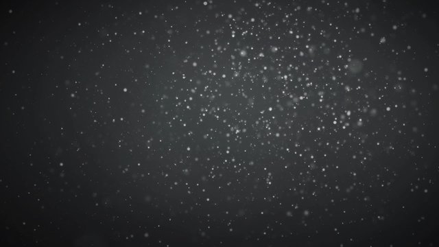 Moving white particles on black abstract background. Seamlessly loopable.