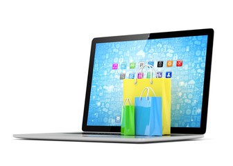 laptop and  shopping pags on white background