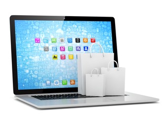 laptop and  shopping pags on white background