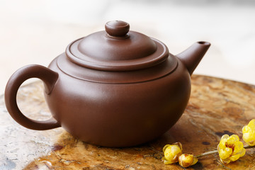 Dark-red enameled pottery teapot