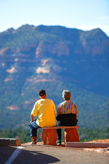 Elderly couple enjoying with beautiful Sedona's red rocks view. 
