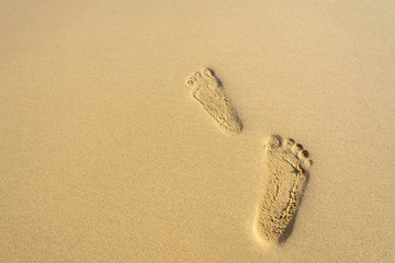 Footprints on the sand beach
