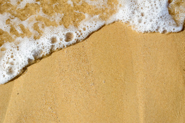 Wave of the sea on the sand beach